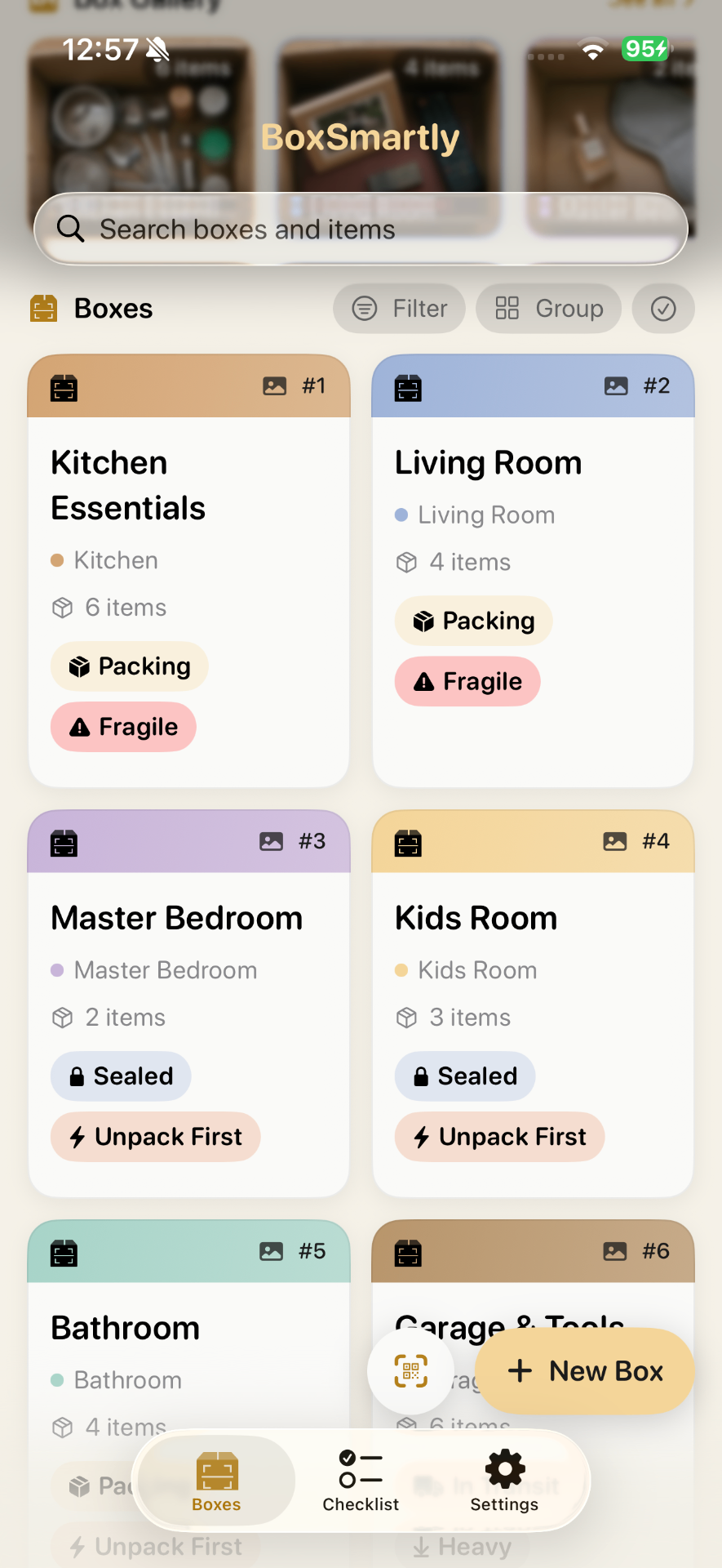 Grid of boxes color-coded by room with packing status and tags like Fragile, Sealed, Unpack First